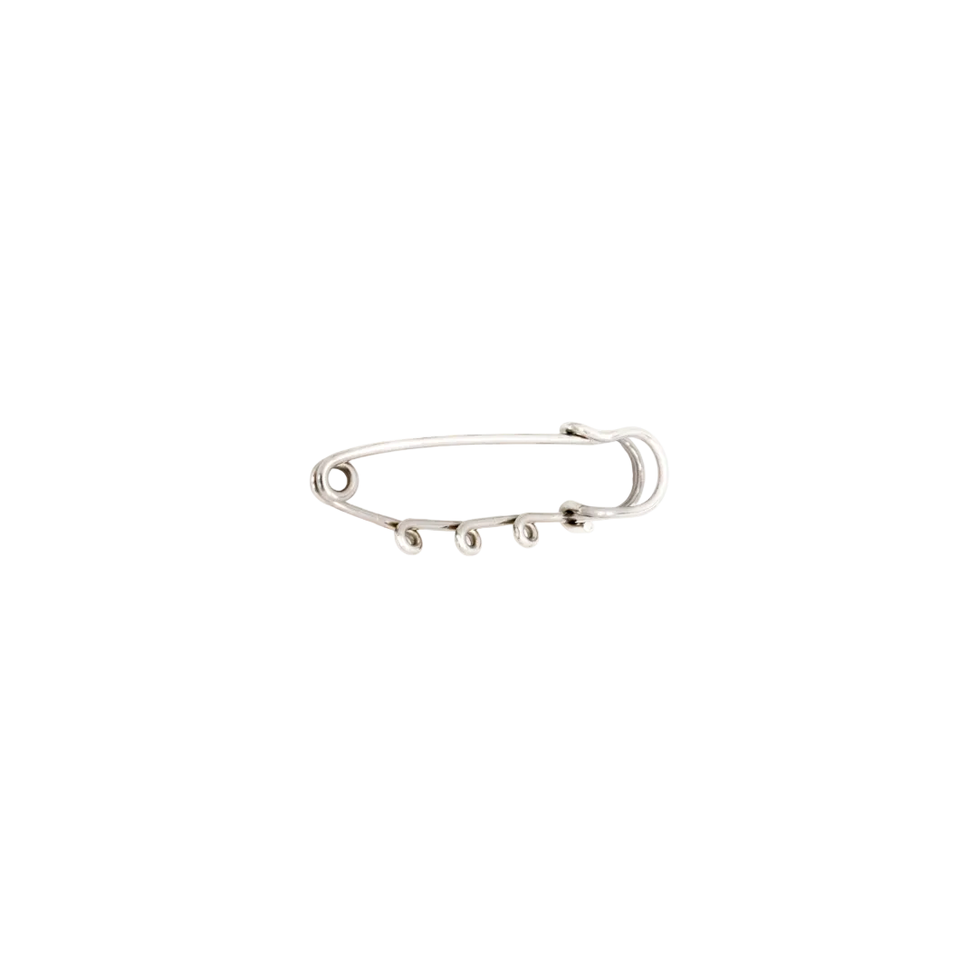Silver safety pin on a white background