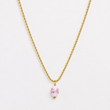 Gold rope chain necklace with pink floral porcelain bead pendant