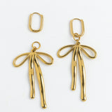 Gold bow charm drop earrings on hinged hoops