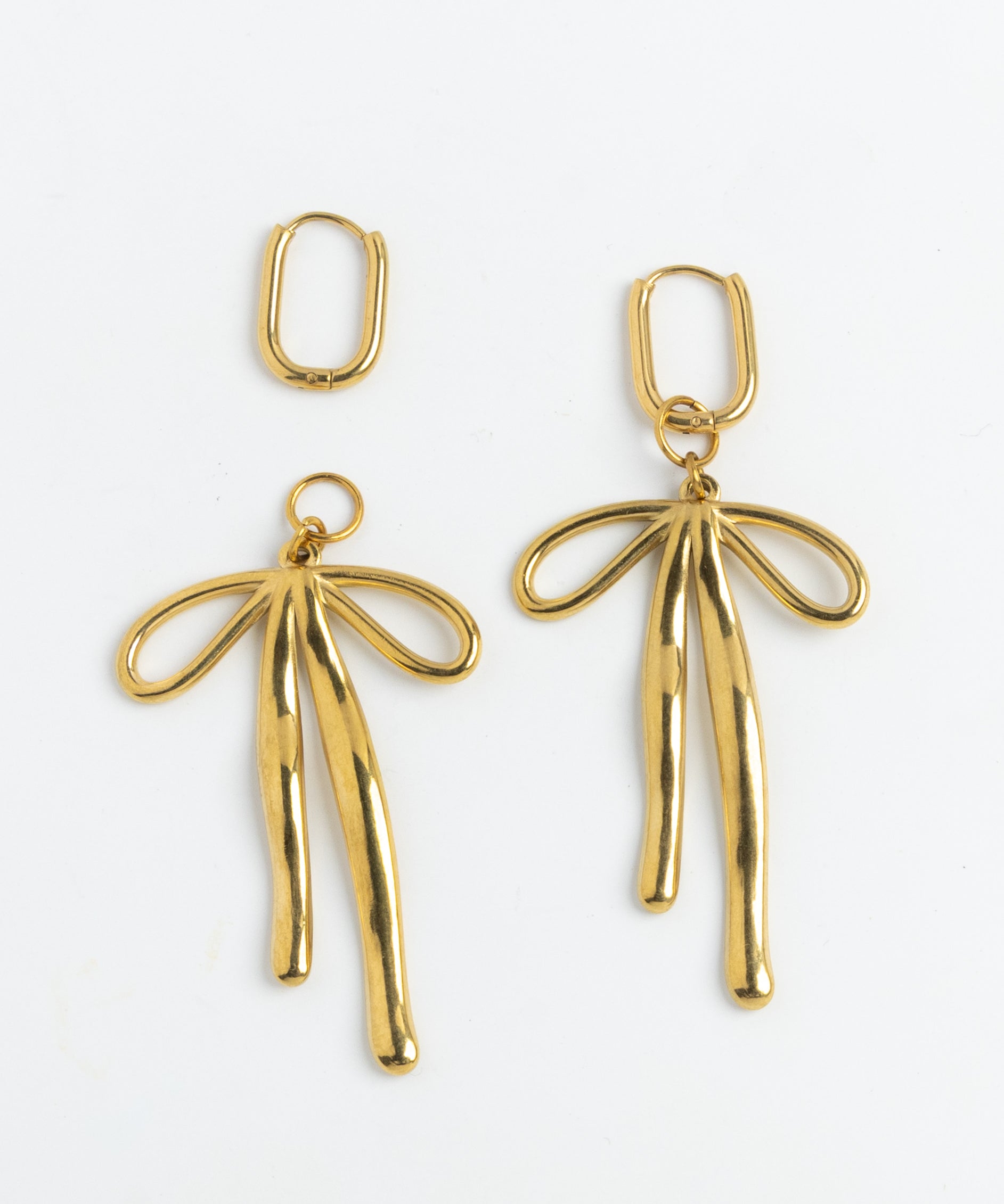 Gold bow charm drop earrings on hinged hoops