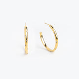 Gold hoop earrings scattered with multicolor gemstones