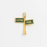 Gold and green enamel Bryant Park street sign post charm