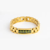Gold watch-link bracelet with green emerald cut stones