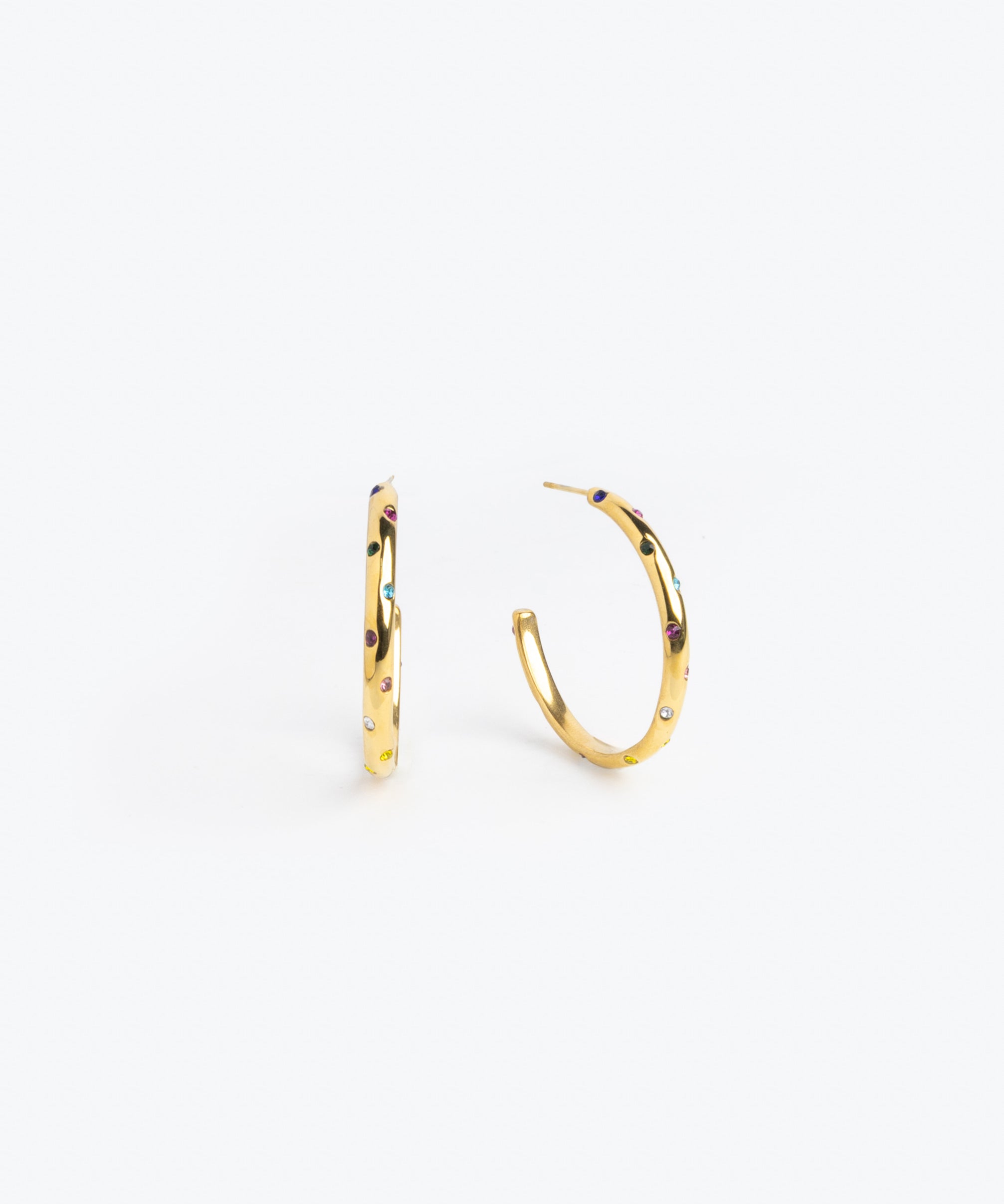 Gold hoop earrings scattered with clear crystal accents
