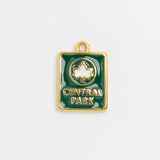 Green enamel Central Park charm with white leaf emblem