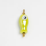 A small glossy lime green fish-shaped charm with a single large white eye and gold-tone metal loop at the top, shown on a plain white background.
