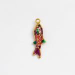 A small gold fish-shaped charm with colorful enamel detailing in red, green, and purple, shown on a plain white background.